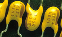Capacitors dipped in Hysol gold epoxy mark very easily with the LaserMark laser. Image for hysol-capacitorsjpg